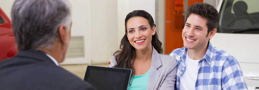 Couple speaking to a representitive